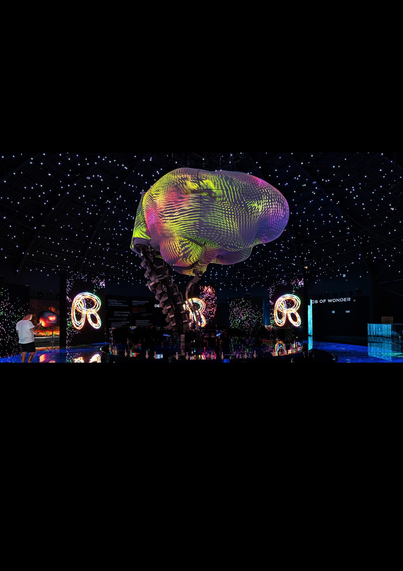 Immersive spectacle production with suspended kinetic sculpture
